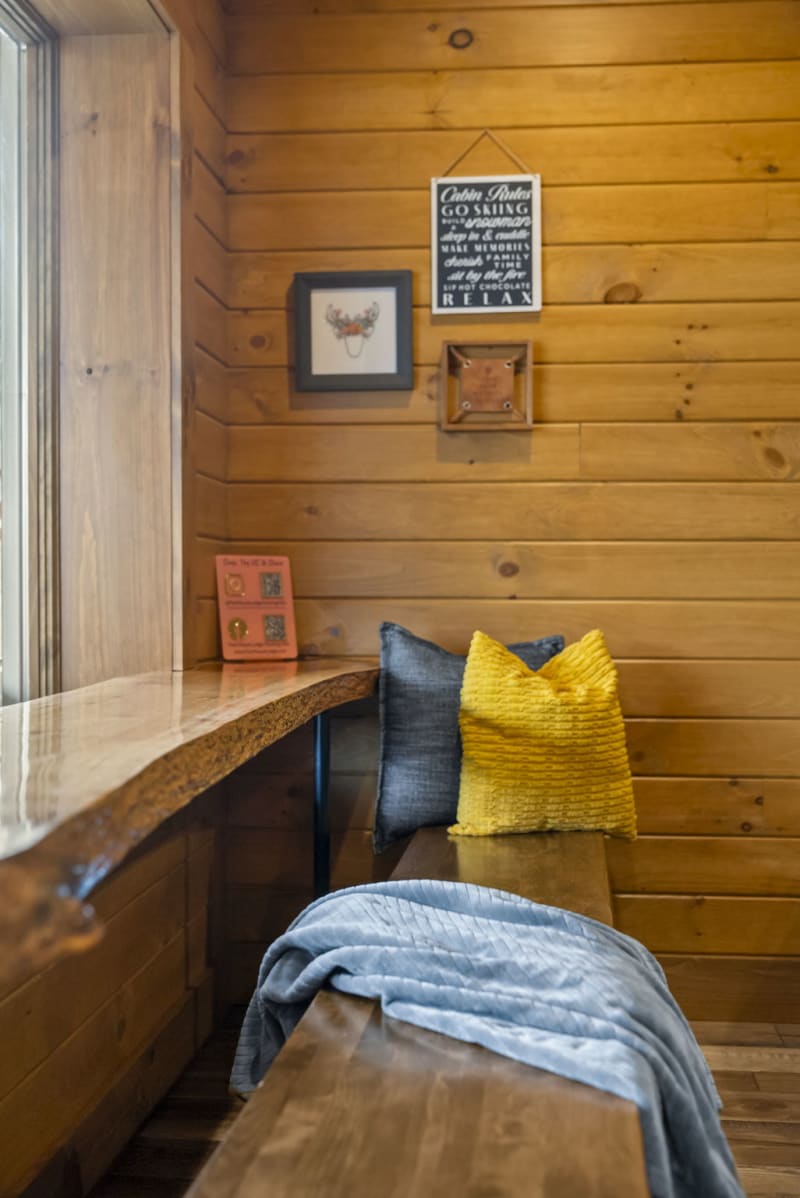 Pool house lodge game room window nook seating yellow pillow