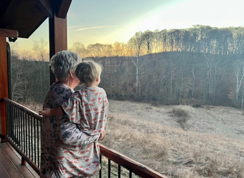 Pool house lodge grandmother grandchild deck sunrise view