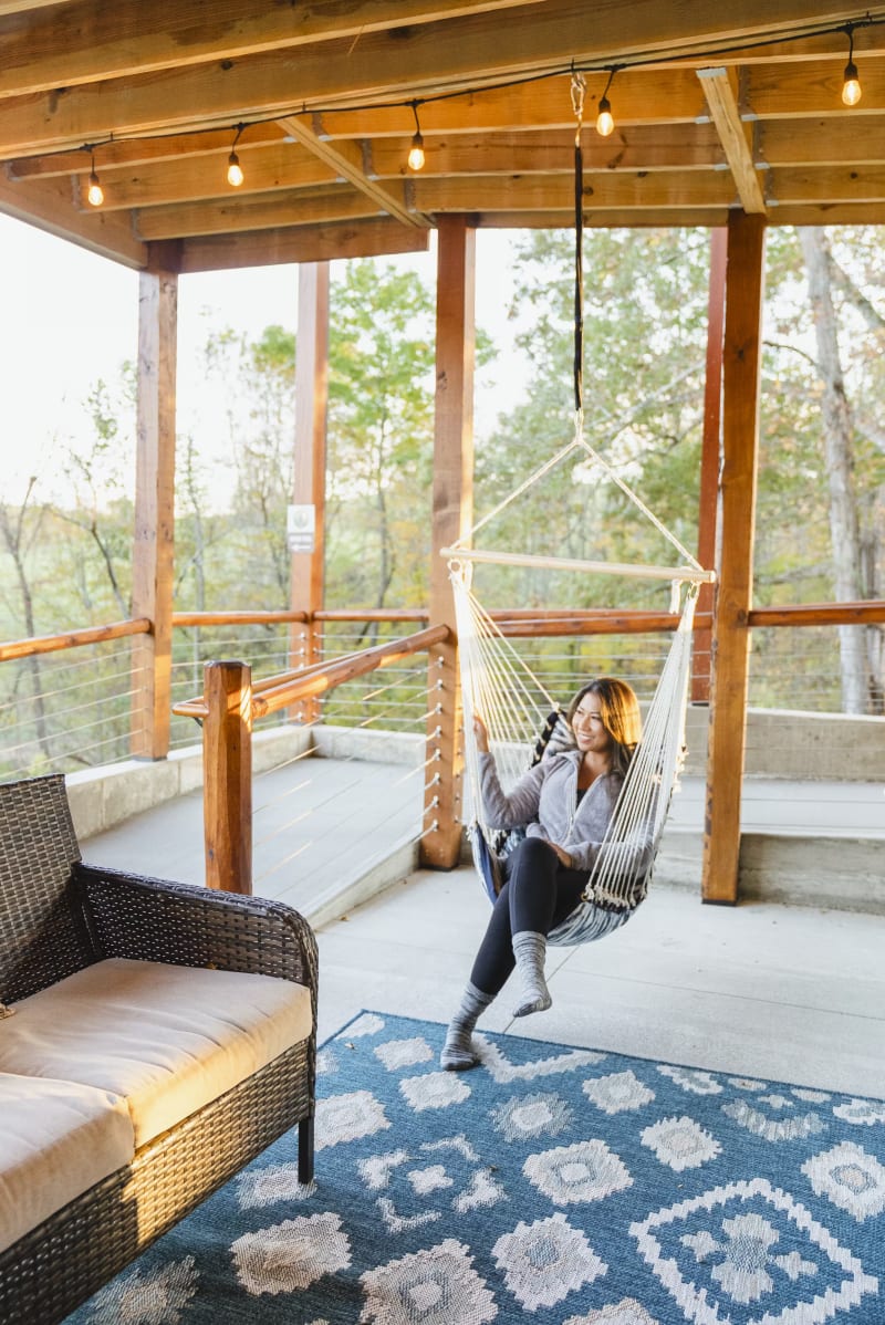 Pool house lodge hammock chair lower deck fall trees
