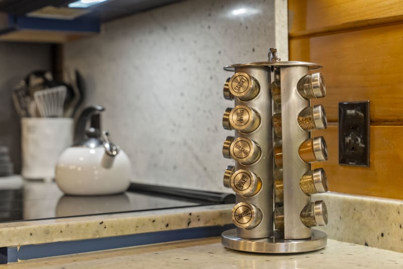 Pool house lodge kitchen spice rack stainless countertop closeup