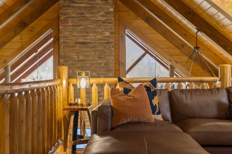 Pool house lodge loft railing leather sofa triangular windows