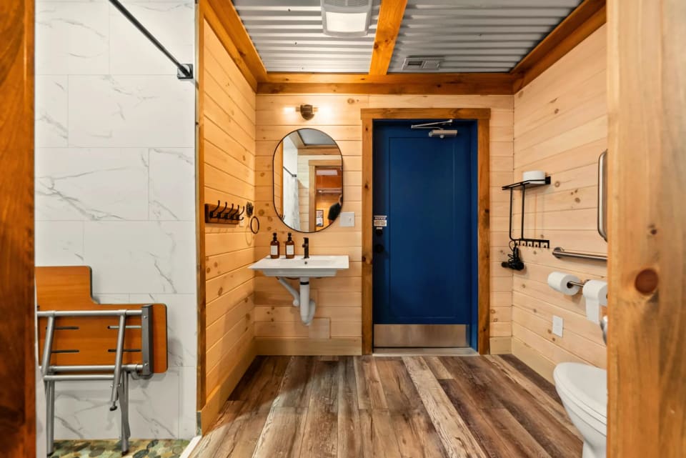 Lower level accessible bathroom at Pool House Lodge