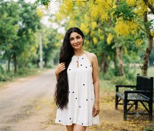 Woman in White Dress on Park Path AI image template preview