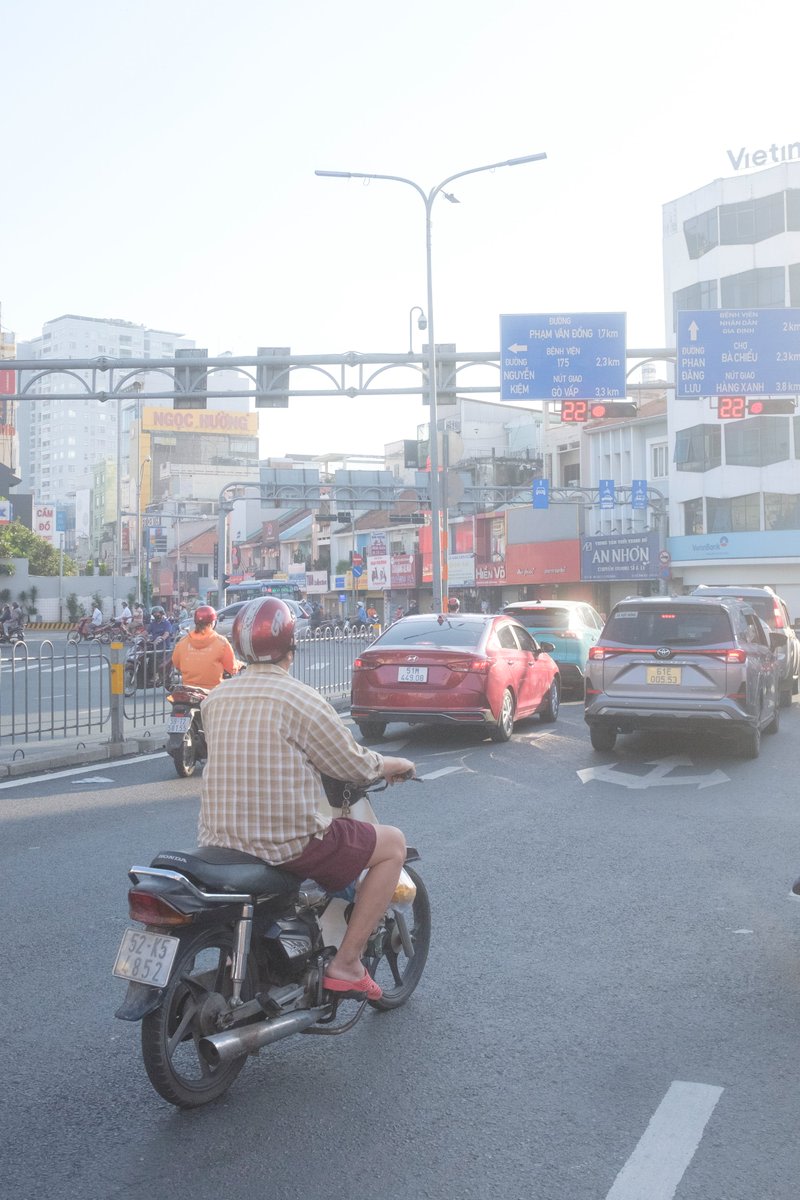 Edit city photo into rainy scene with Vietnamese bikers AI image template preview