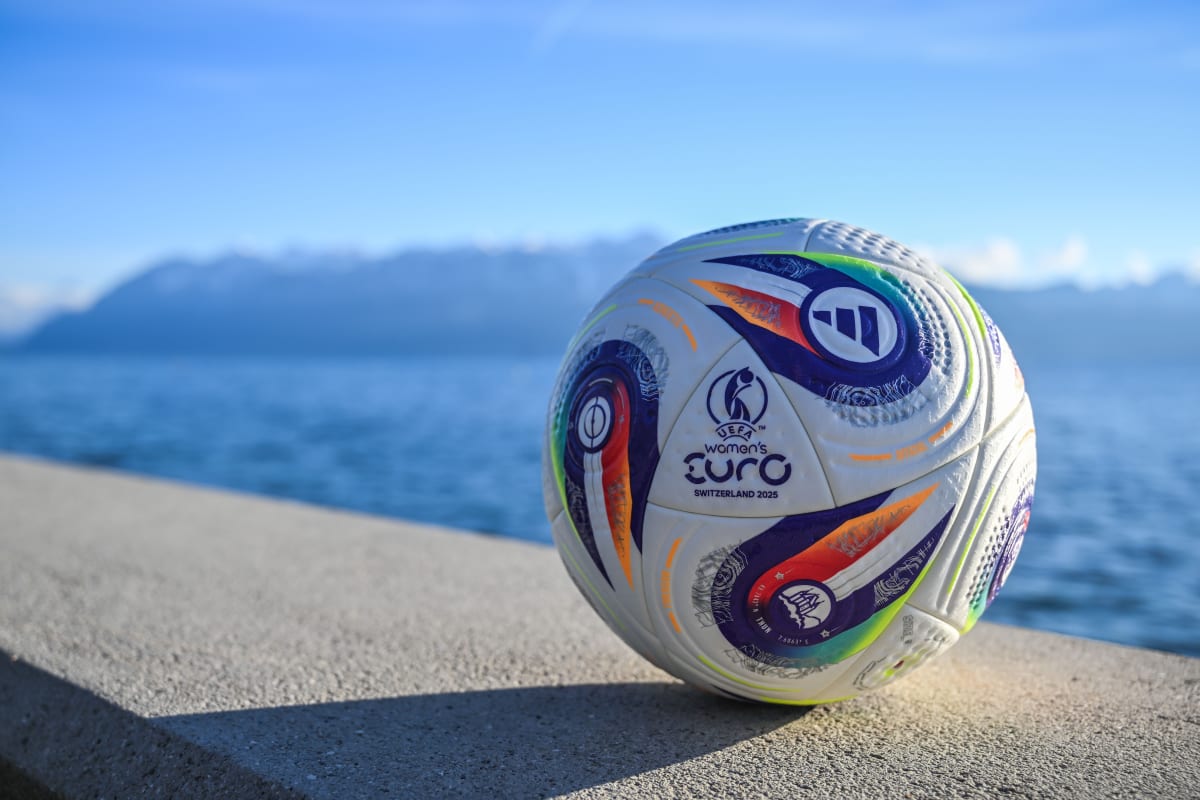 Women's EURO 2025 Final Tournament ball in front of a lake.