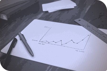Un cuadro de notas con un lápiz y un círculo de medidas.