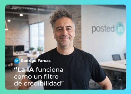 Rodrigo Farcas, a man with a beard, is posing for a picture in front of a brick wall.
