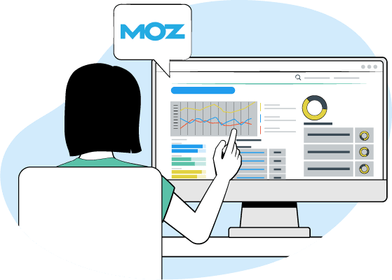 Una mujer está sentada delante de un monitor de computadora, tocando el pantalla con su dedo.