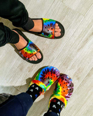 tie dye crocs on feet