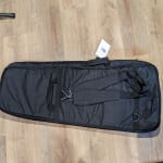 Sufficient, basic gig bag for slightly larger guitars