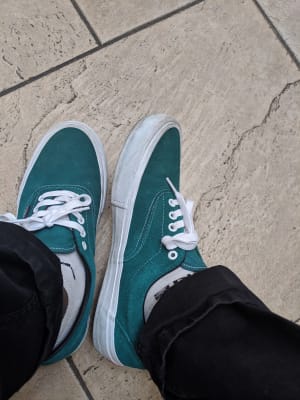 green vans on feet