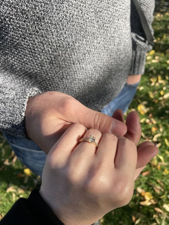 Oval diamond ring on hand