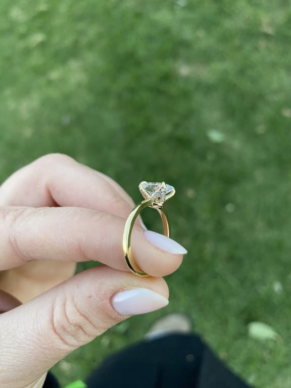 Oval diamond ring on hand