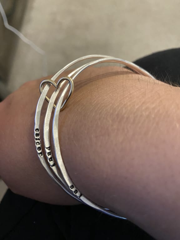 Personalized All Heart Bangle Set from Uncommon Goods. Customer submitted image.