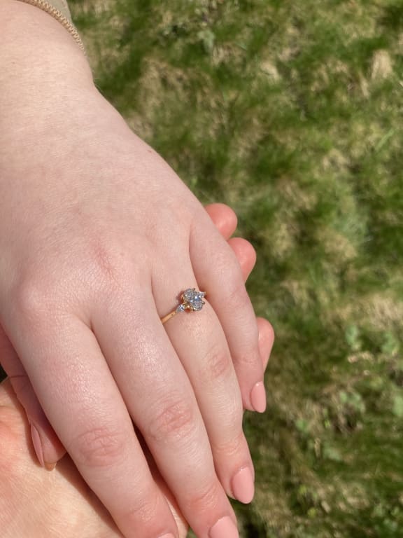 Oval diamond ring on hand