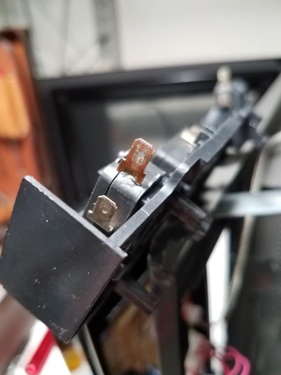 Lower door switch with heat damage