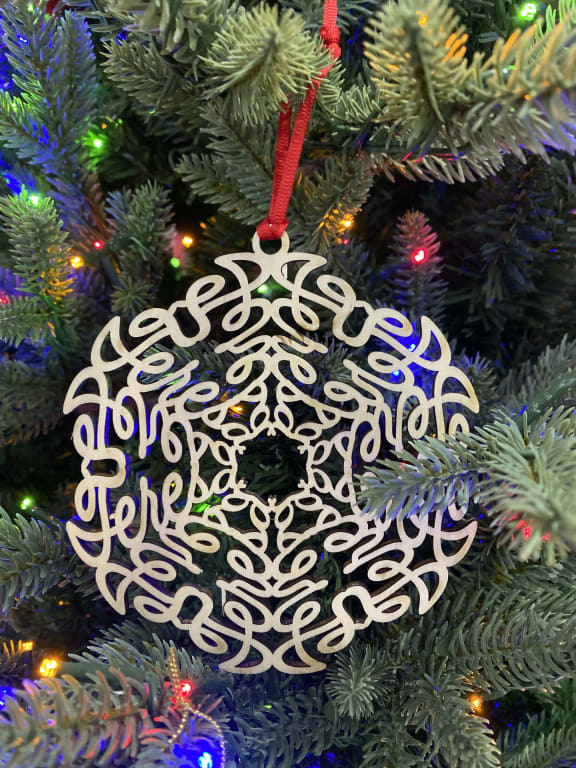 Your Name in a Snowflake Ornament from Uncommon Goods. Customer submitted image.
