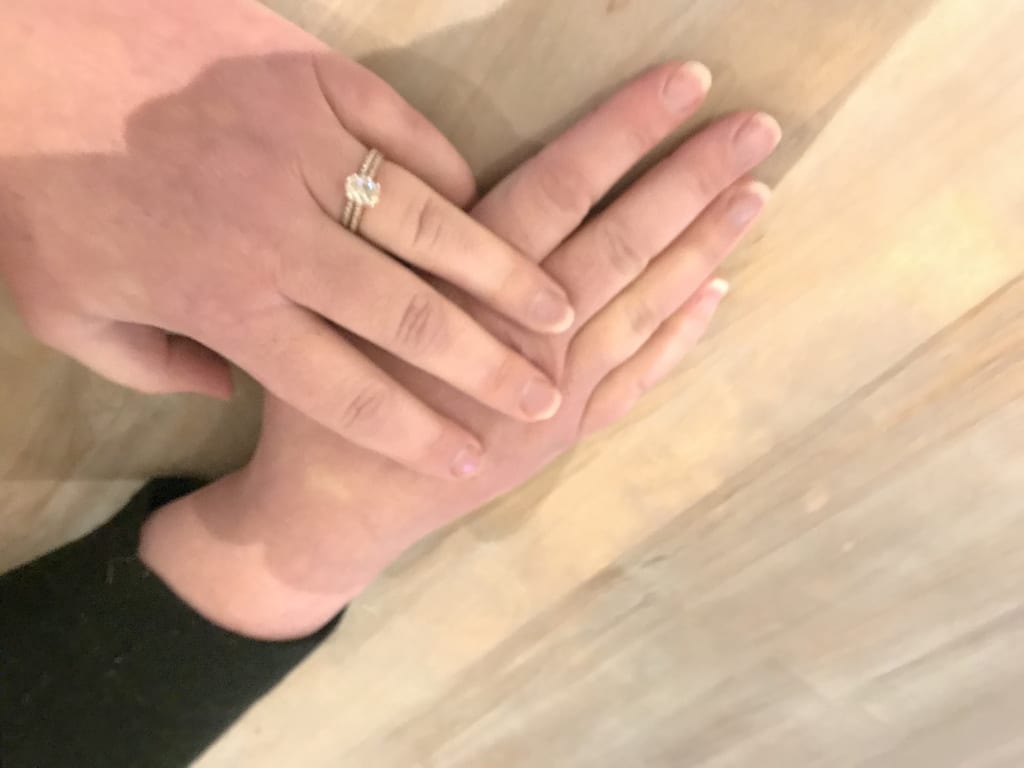 Oval diamond ring on hand