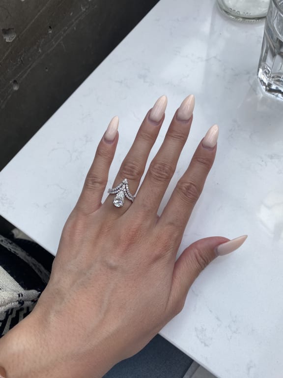 Oval diamond ring on hand