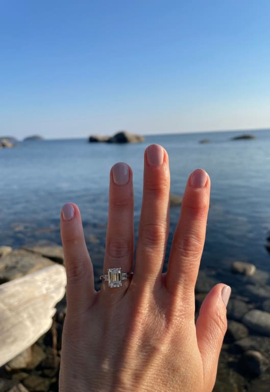 Oval diamond ring on hand