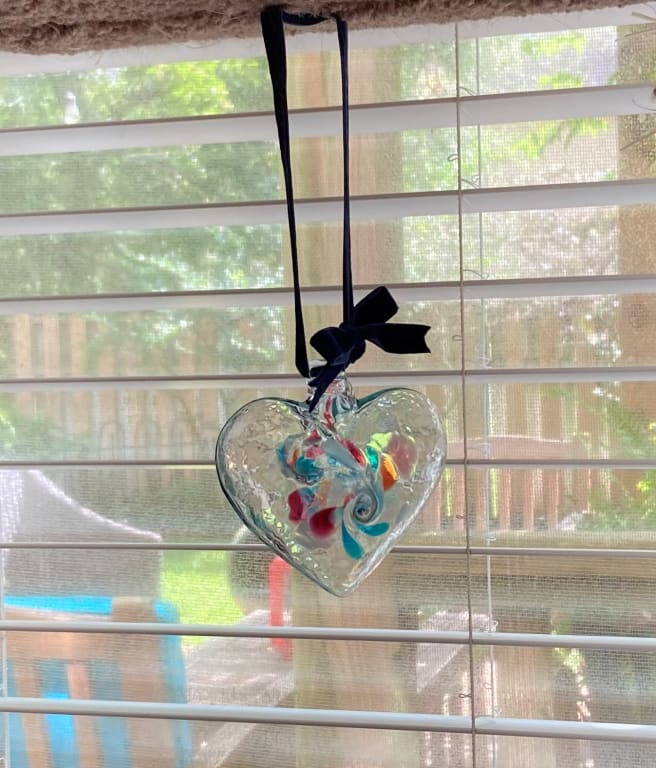Heart of Memories Glass Window Charm from Uncommon Goods. Customer submitted image.