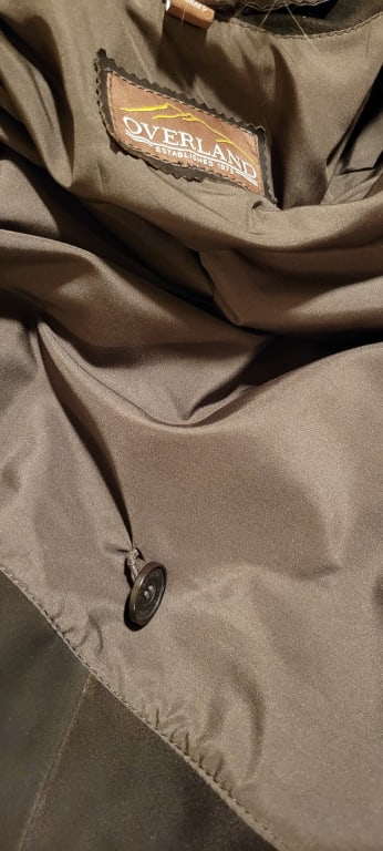 Customer Image Captioned: Inside button is dangling as if it was previously used
