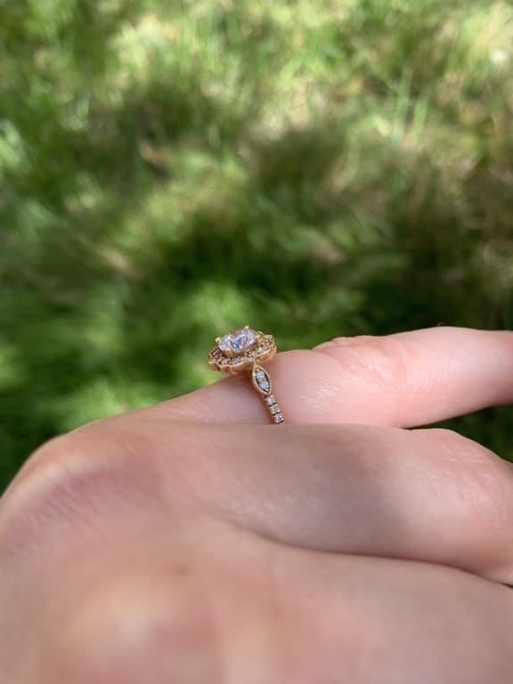 Oval diamond ring on hand