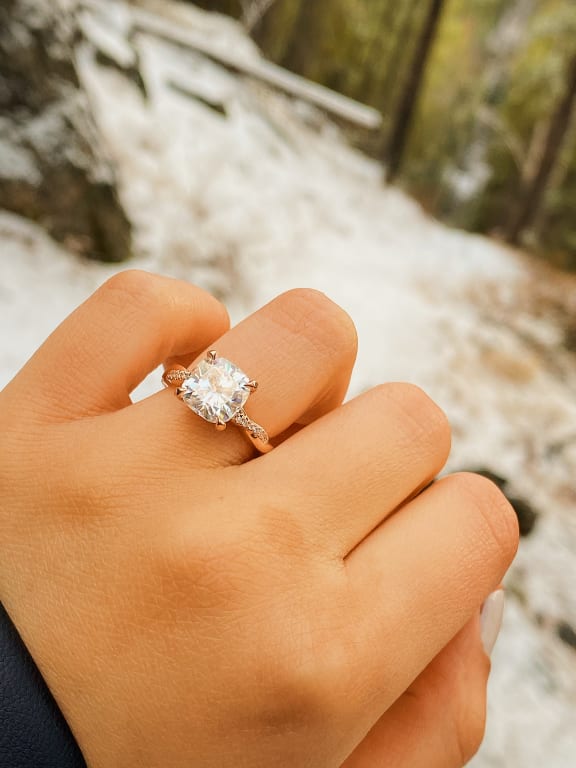 Oval diamond ring on hand