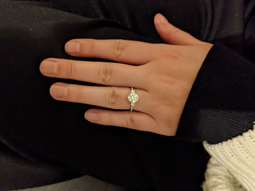 Oval diamond ring on hand