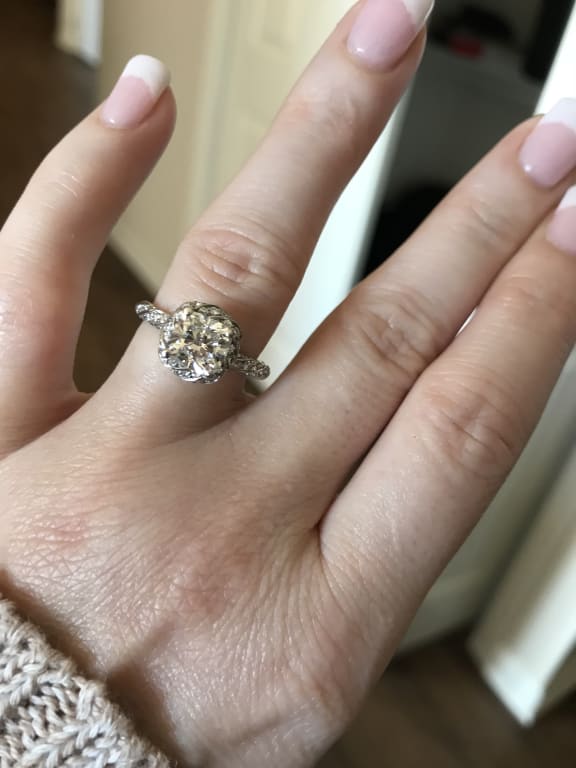 Oval diamond ring on hand