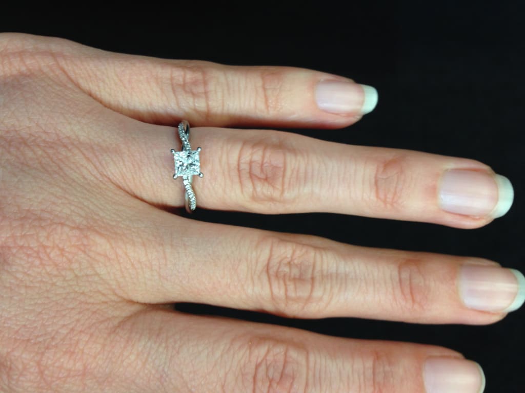 Oval diamond ring on hand