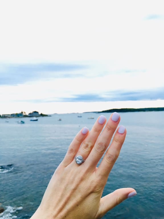 Oval diamond ring on hand