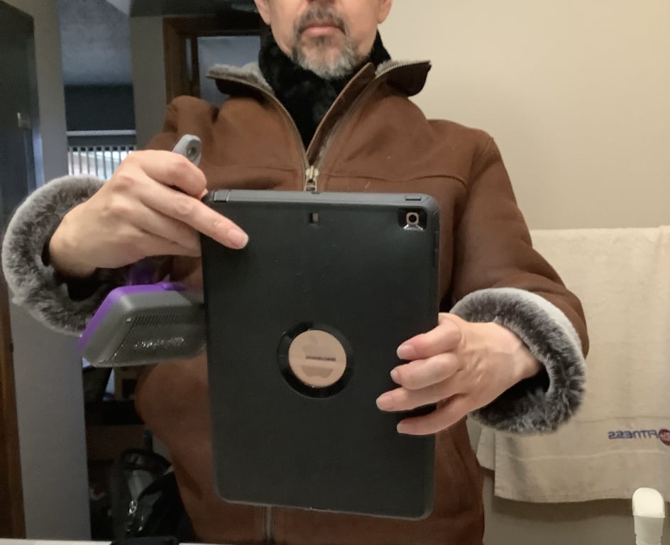 Customer Image Captioned: Jacket with scarf for low temps. Don't forget to get a slicker brush!