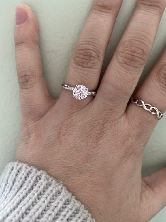 Oval diamond ring on hand