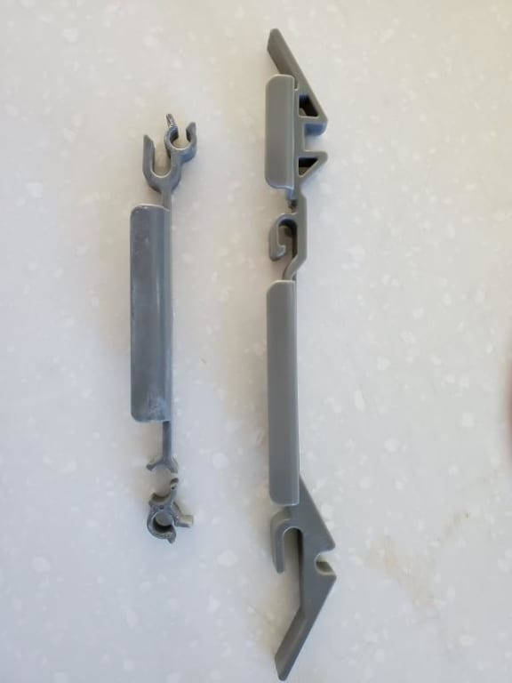 Original broken part on left