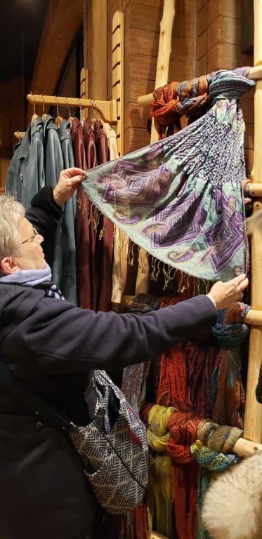 Customer Image Captioned: Me wearing my new scarf and admiring more in your Denver store.