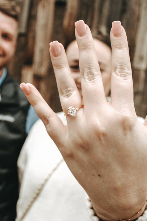 Oval diamond ring on hand