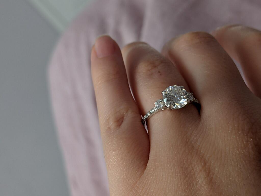 Oval diamond ring on hand