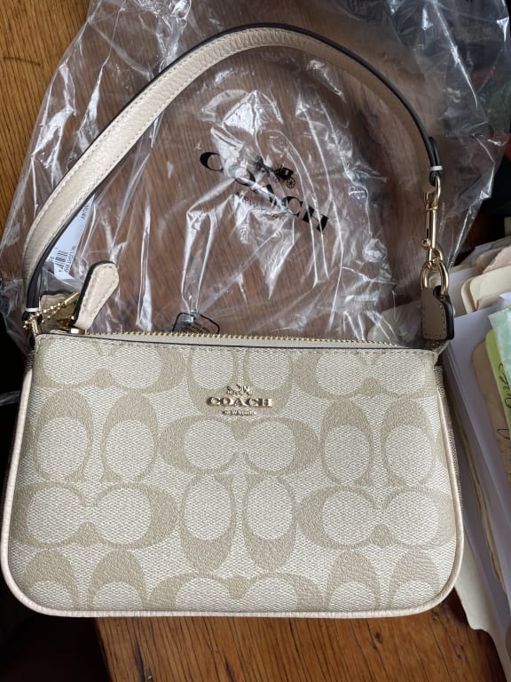 COACH Outlet Nolita 19 In Signature Canvas With Floral Whipstitch 228.00