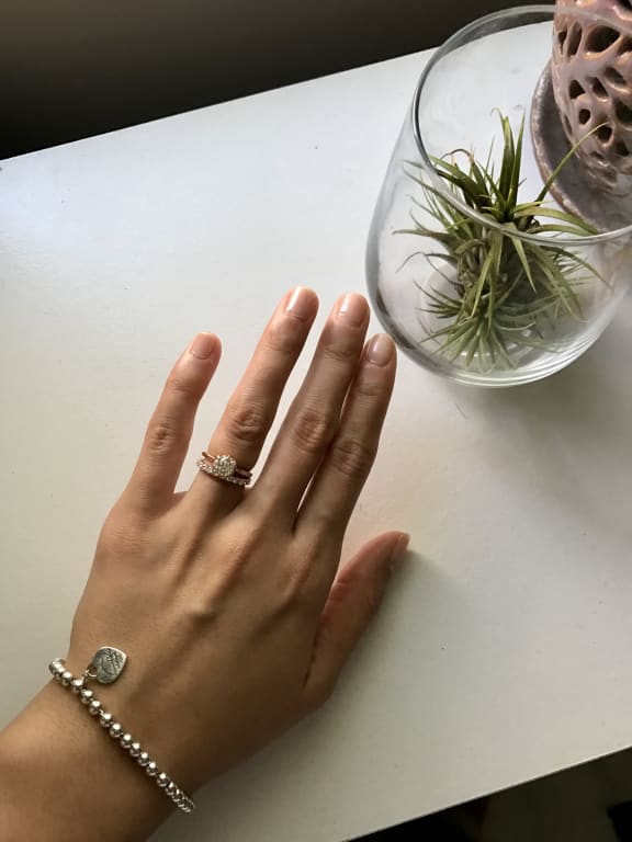 Oval diamond ring on hand