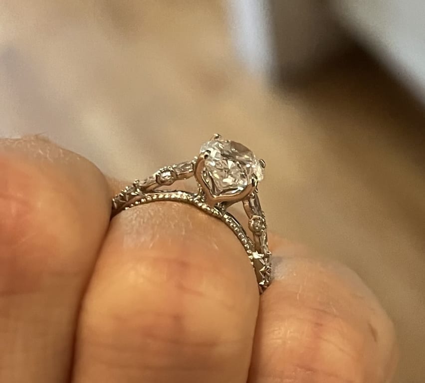 Oval diamond ring on hand