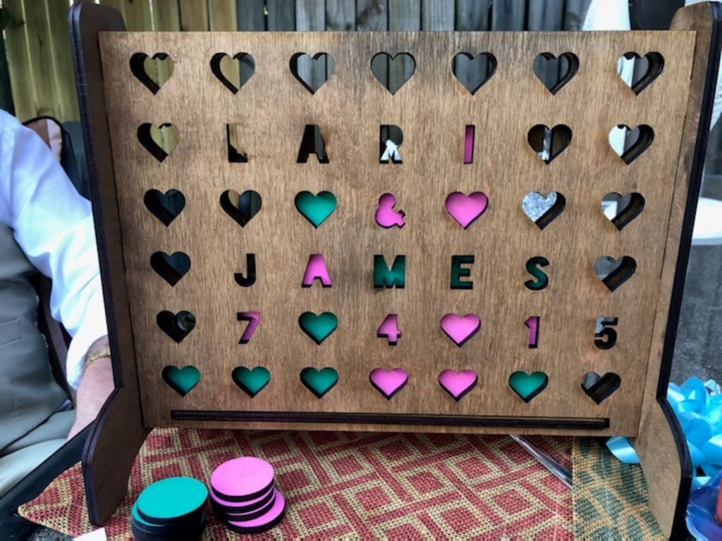 Personalized Hearts Four-Across Game from Uncommon Goods. Customer submitted image.