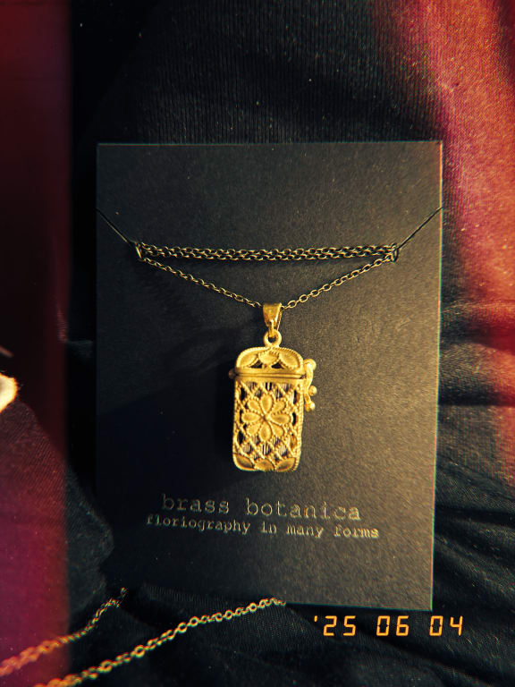 Tiny Tarot Deck Necklace from Uncommon Goods. Customer submitted image.