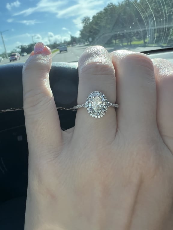 Oval diamond ring on hand