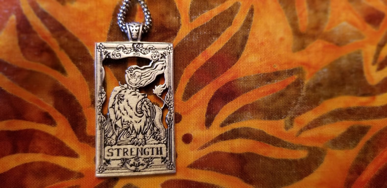 Tarot Card Necklaces from Uncommon Goods. Customer submitted image.