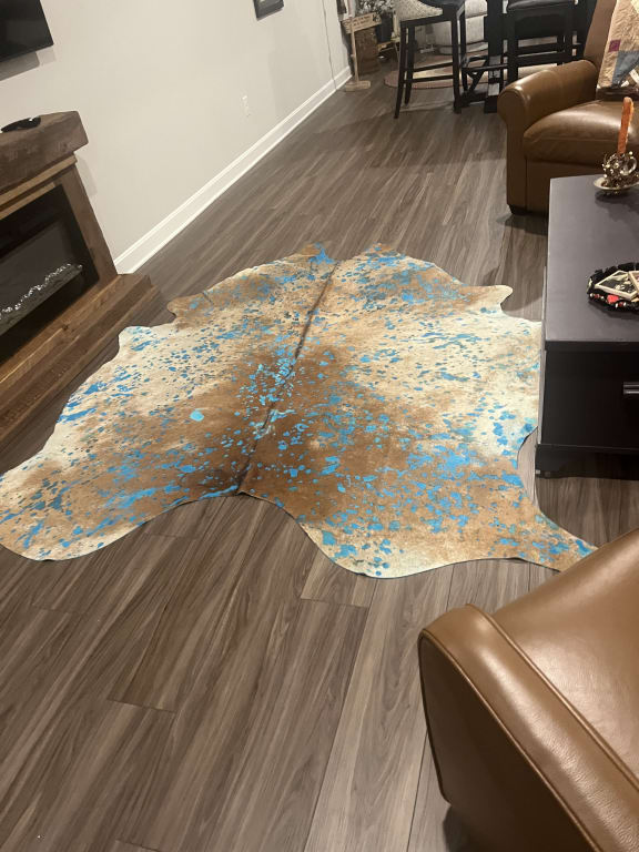 Customer Image Captioned: Cowhide rug