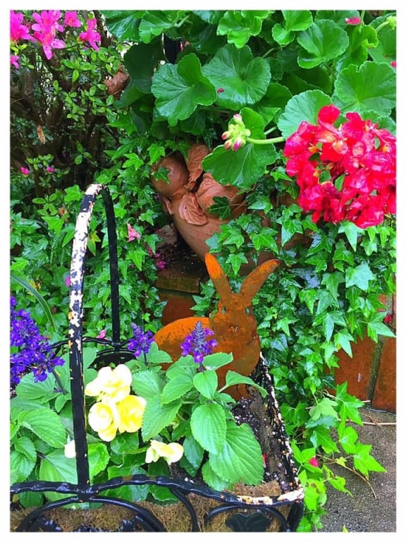 Bunny Family Garden Sculptures - Set of 5 from Uncommon Goods. Customer submitted image.