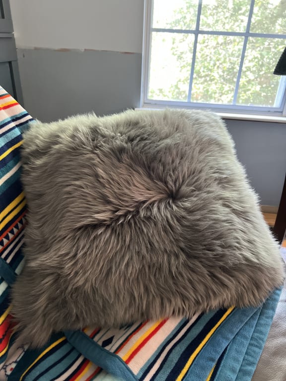 Customer Image Captioned: Beautiful gray wool pillow
