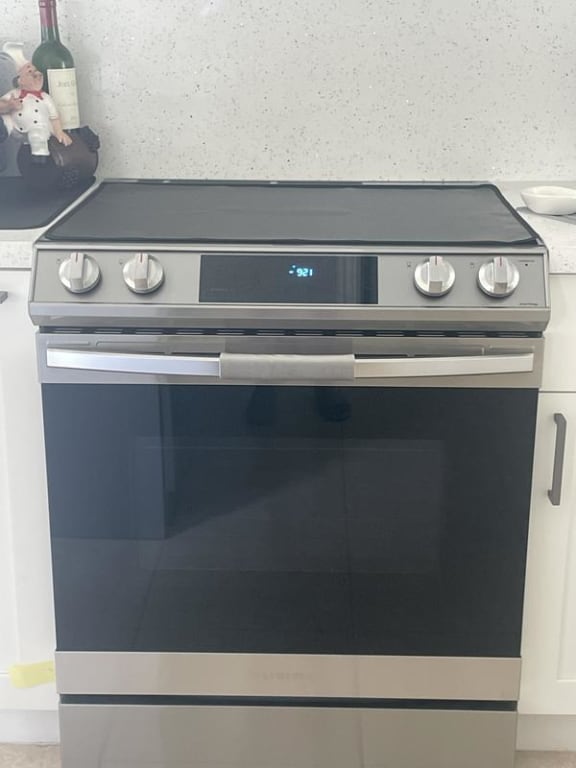 Samsung 6.3 Cu. ft. Slide-in Electric Range with Air Fry, Black Stainless Steel - NE63T8511SG