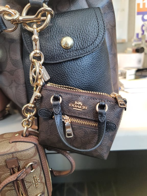 COACH®  Mini Saddle Bag Charm In Signature Canvas